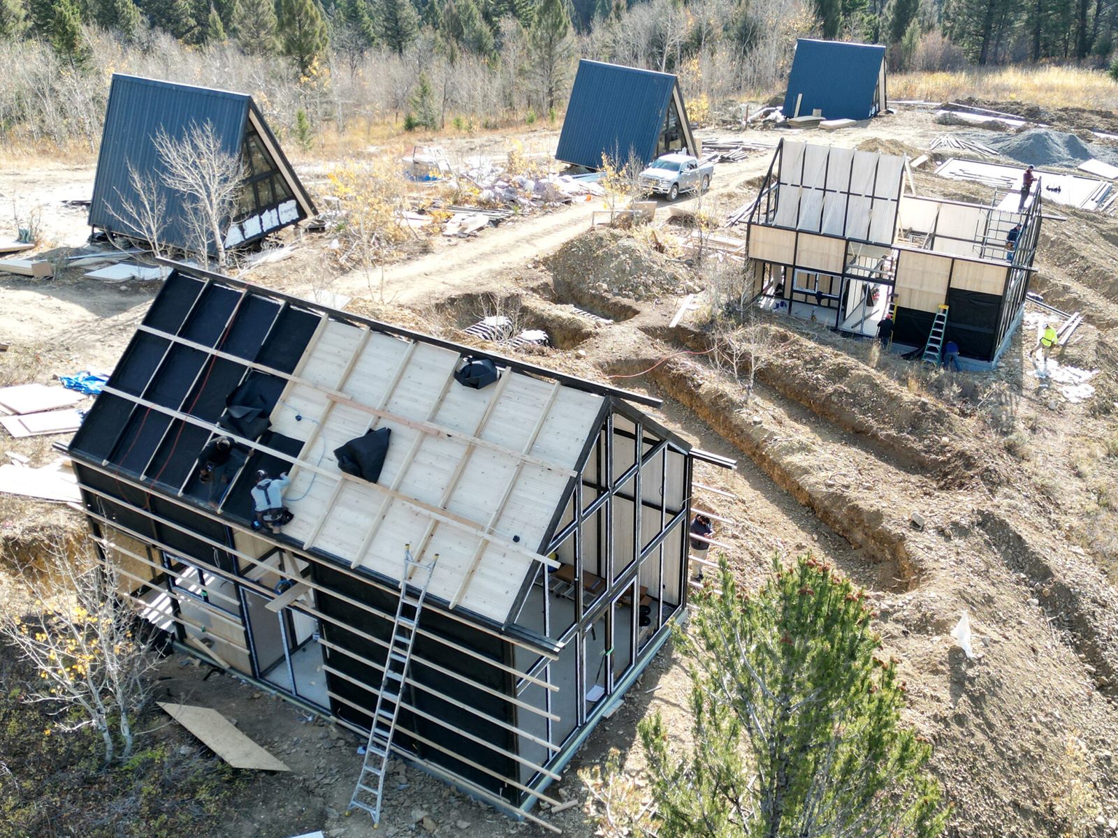 Aerial view of an Aries 116 cabin with roof panels partly installed during construction in Island Park, ID.