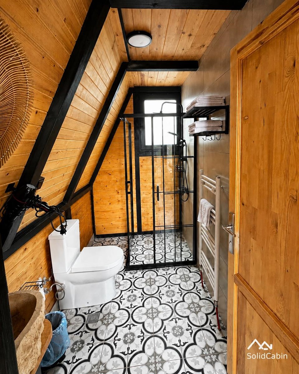 Bathroom finishes from a completed project; sanitary fixtures and local fit-out are separate from the standard kit.