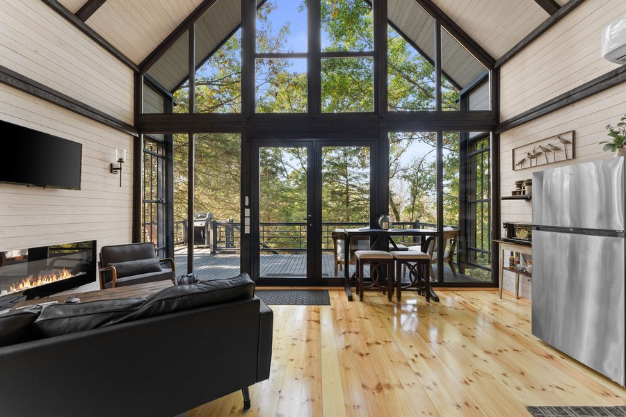 Aries 96 Arkansas concept cabin interior with panoramic windows and an open-plan living area