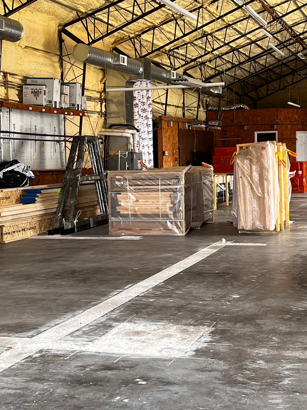Arkansas Aries 96 cabin-kit materials in temporary storage after delivery.