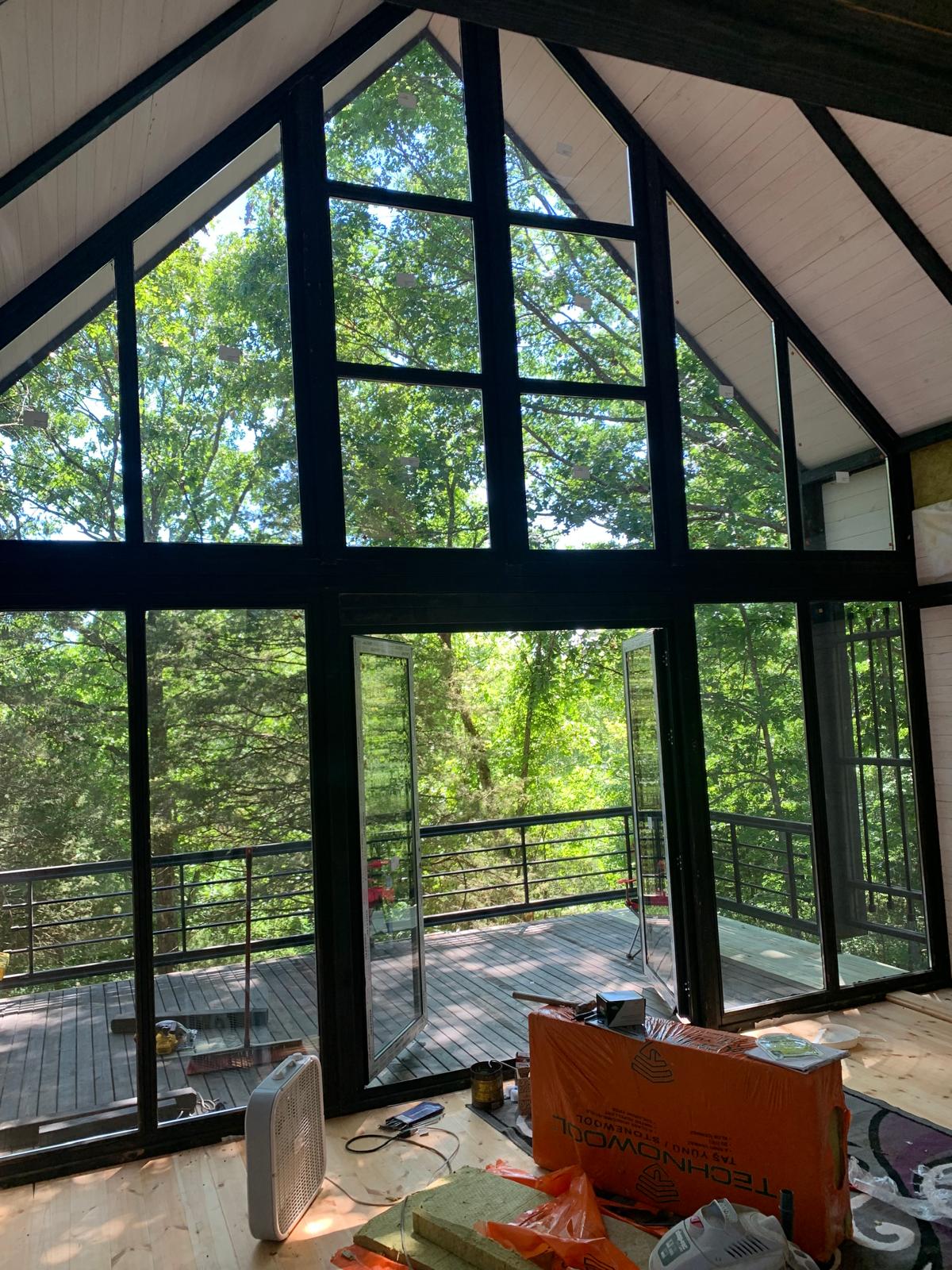 Completed panoramic doors opening onto the deck of the Arkansas Aries 96 cabin.