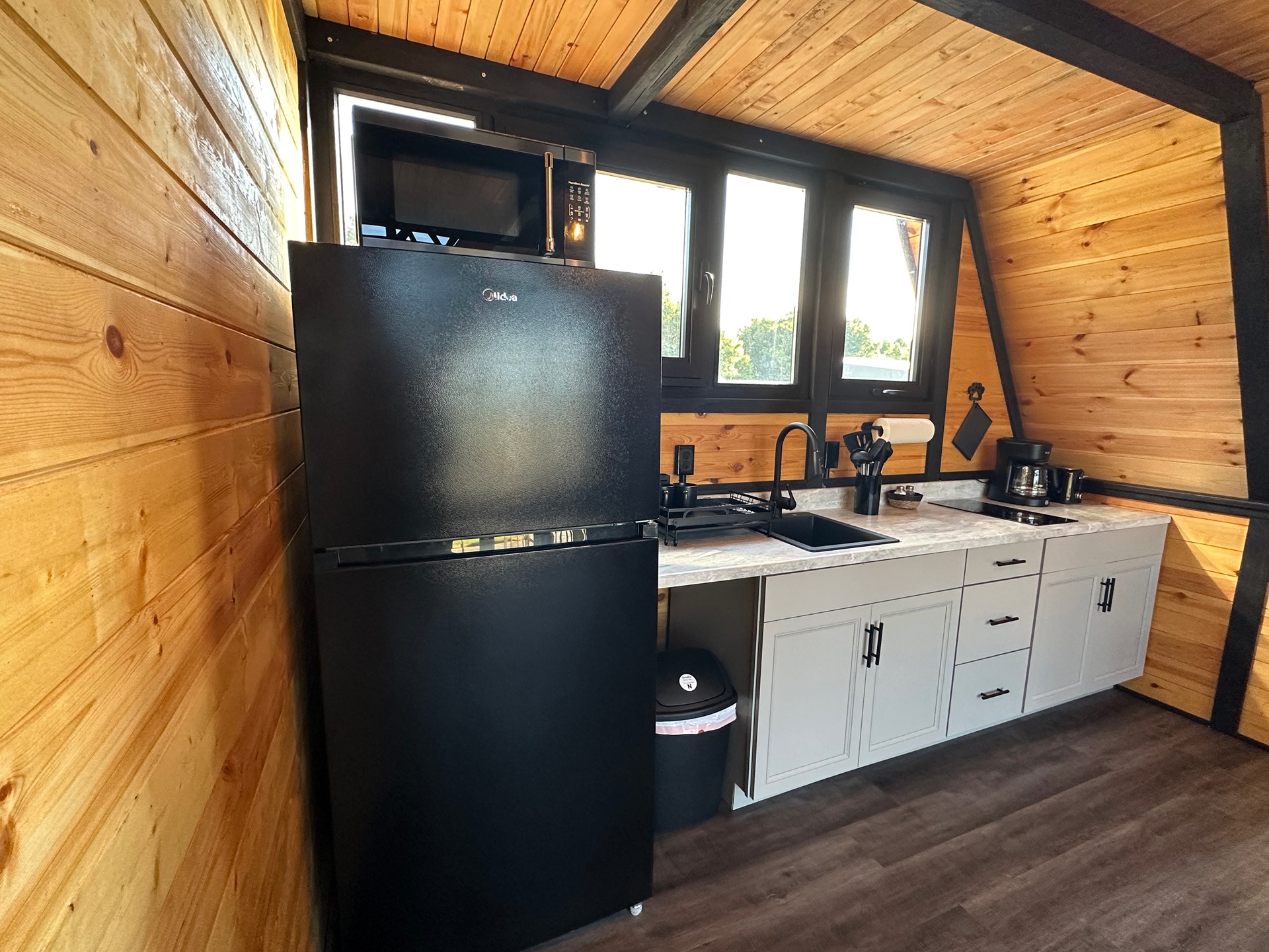 Finished kitchen and dining area inside a Stella 70 cabin at WV ATV Resort.