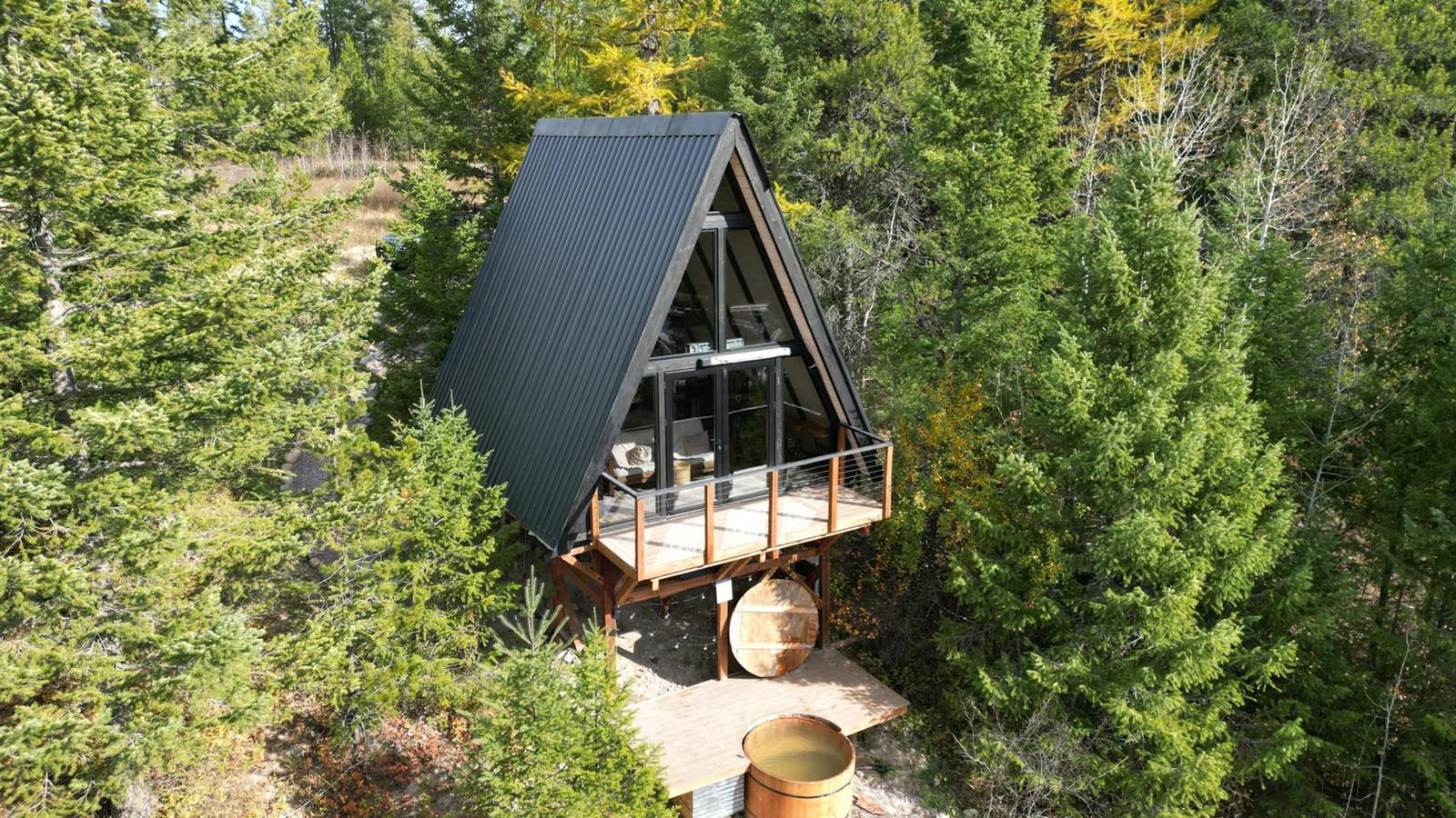 Stella 53 A-frame cabin kit assembled in Montana forest setting