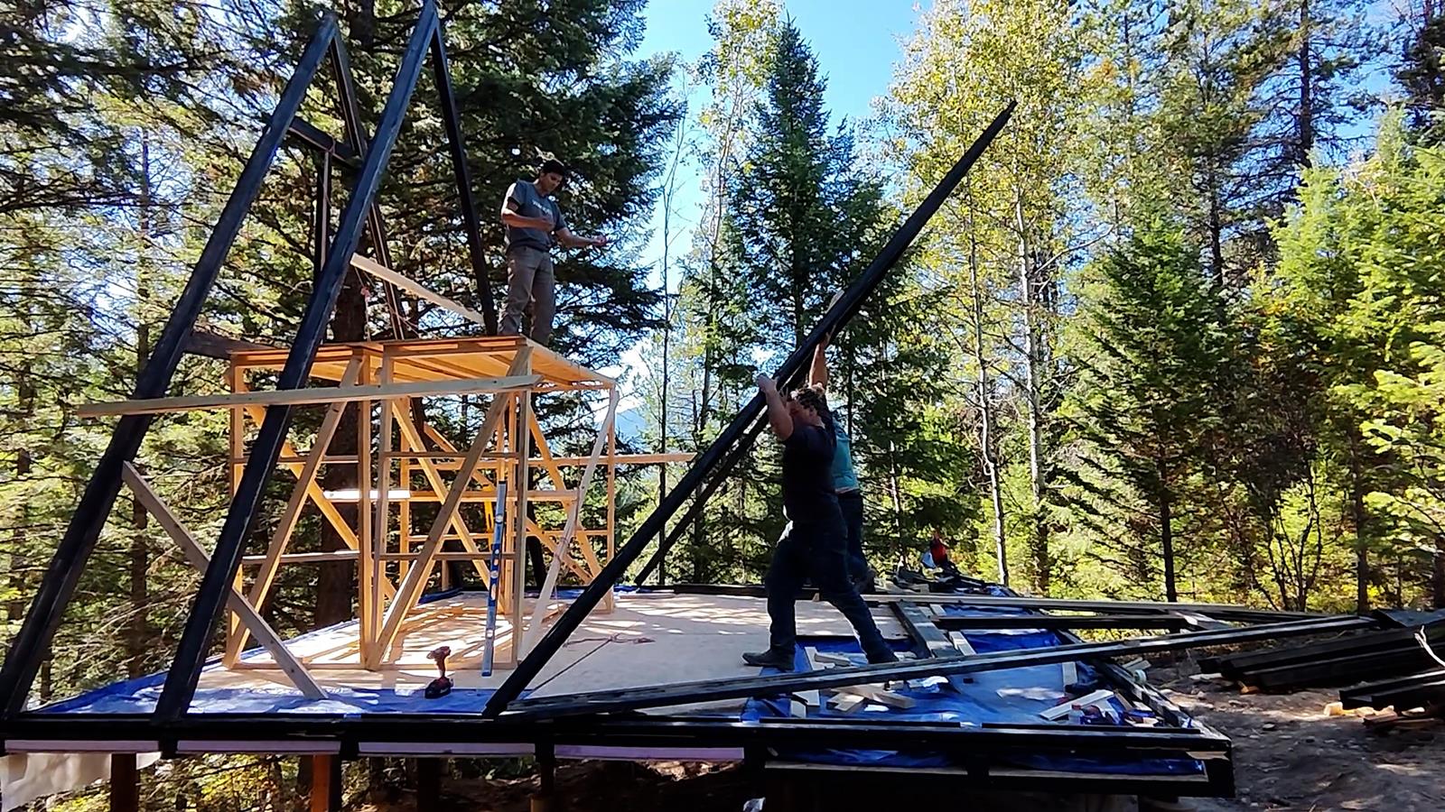 Stella 53 A-frame cabin kit frame assembly on the Montana project site.