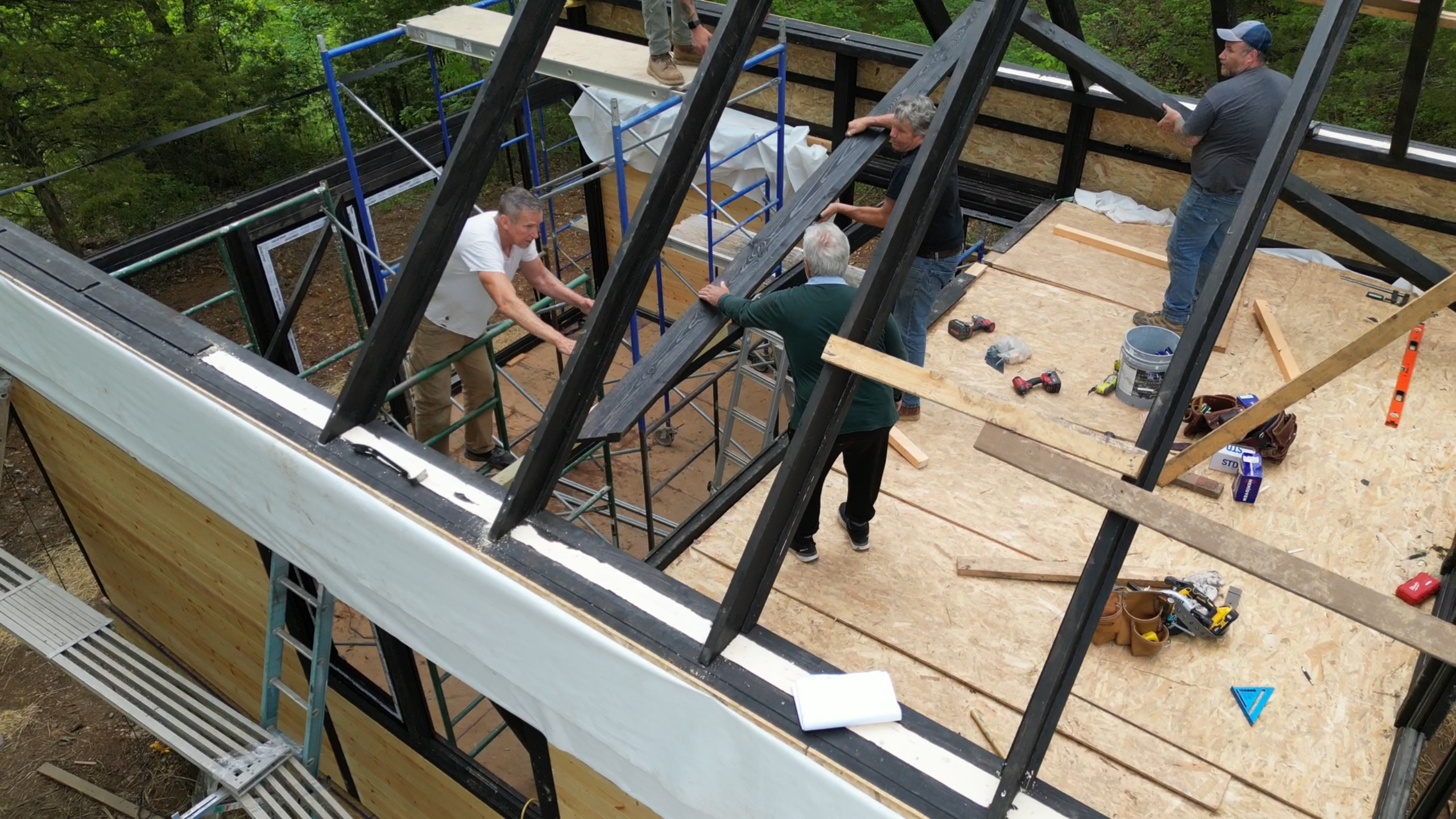 Rafters being installed on the Arkansas Aries 96 A-frame roof.