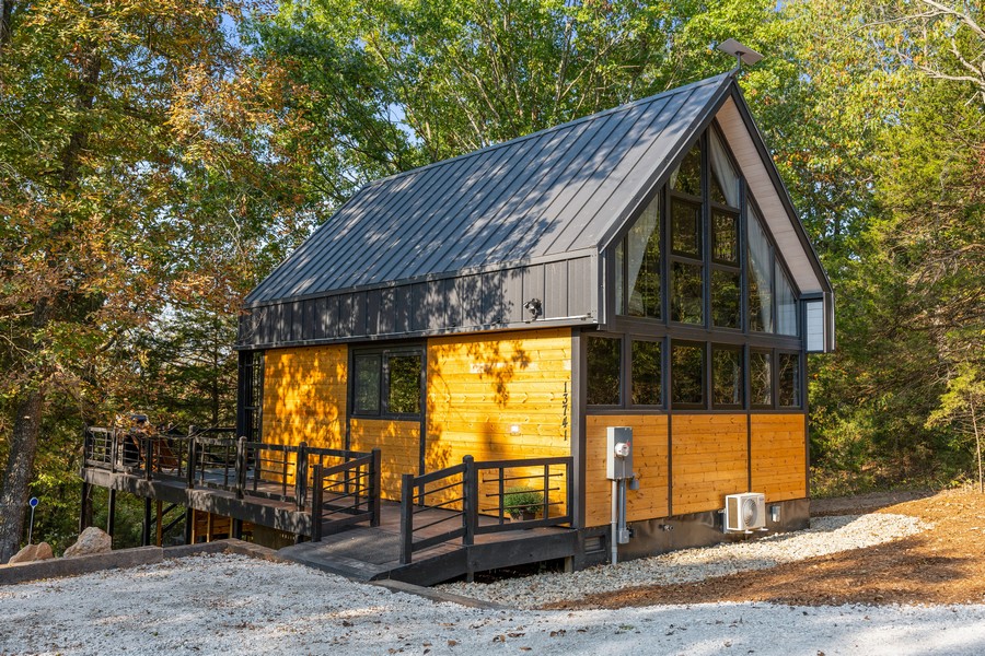 Rear exterior view of the completed Aries 96 rental cabin in Omaha, Arkansas.