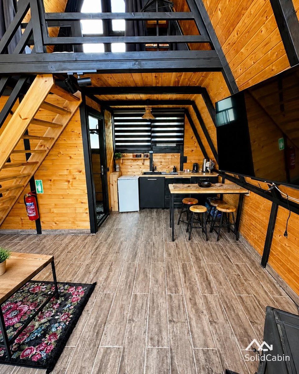 A completed project showing the connection between the kitchen, living area and open loft.