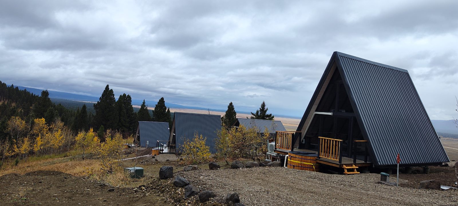 Wide view of a Stella 53 cabin and surrounding hospitality site in Island Park, ID.