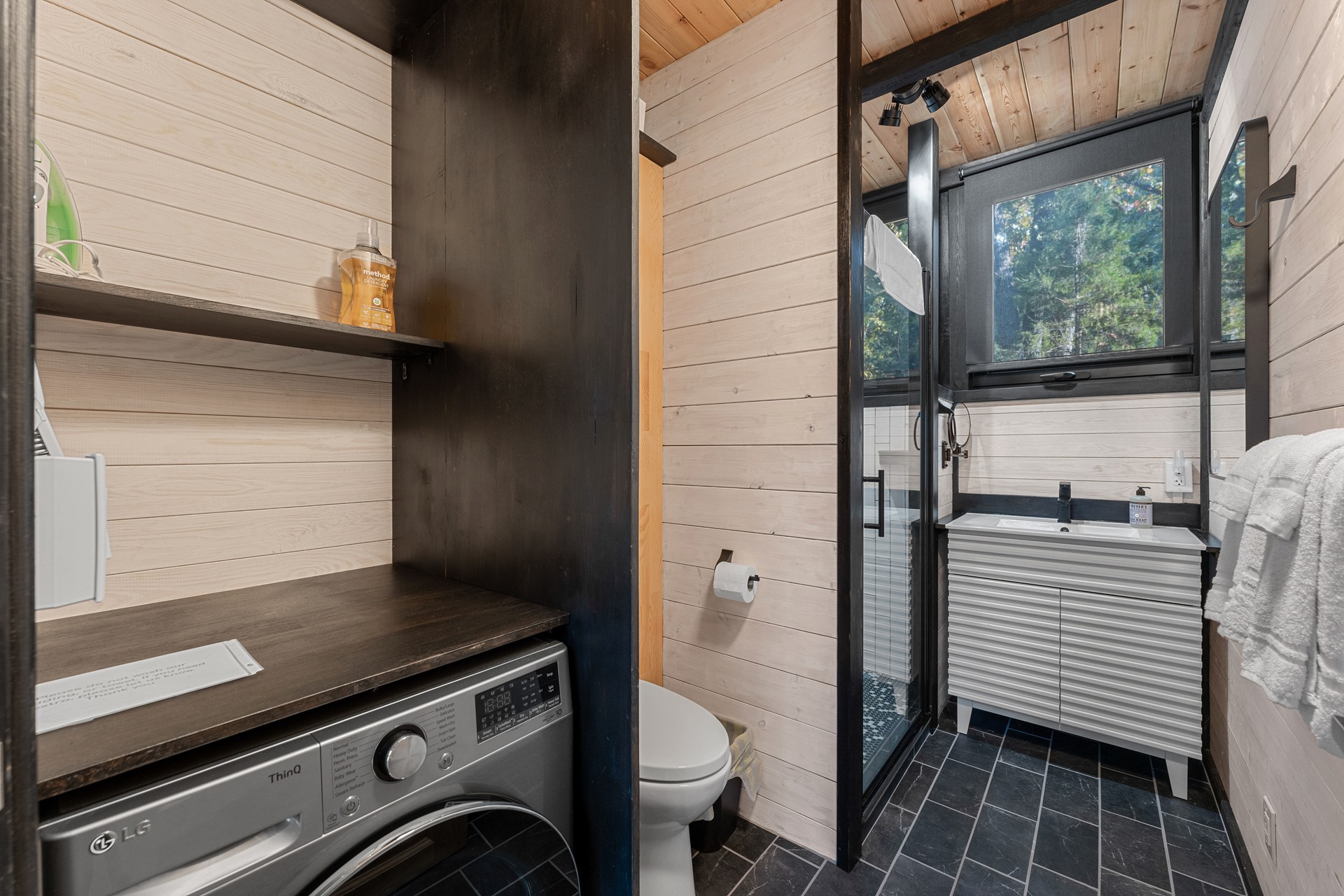 Bathroom and laundry area in the completed Arkansas Aries 96 cabin.