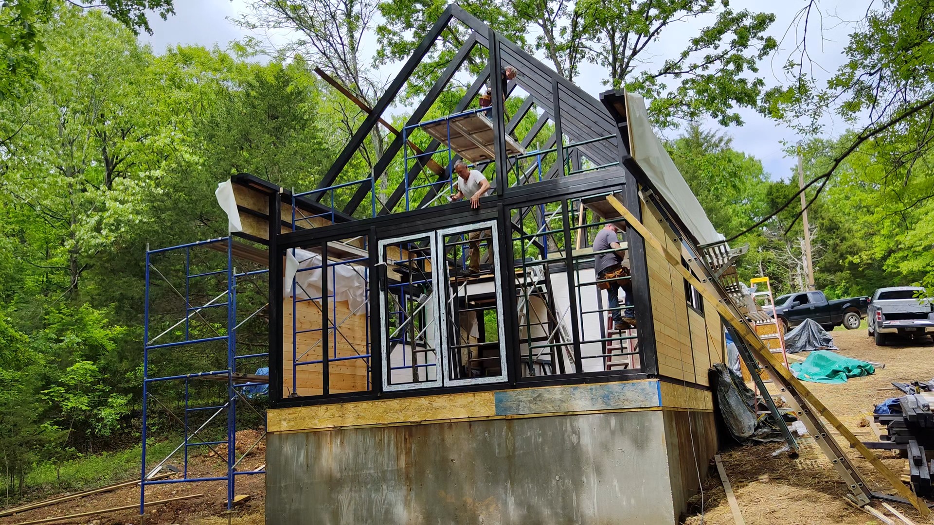 Front and side framing stage of the Aries 96 cabin kit in the Arkansas Ozarks.