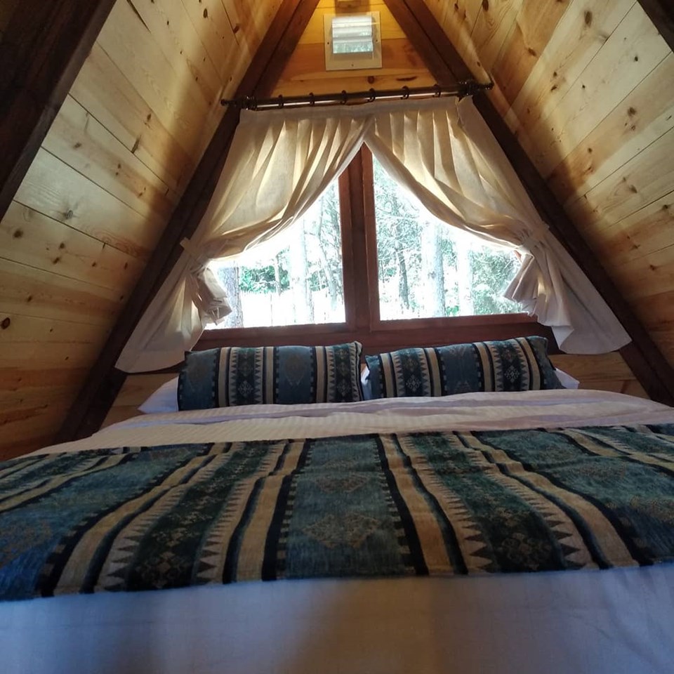 A furnished sleeping loft beneath the Stella 38 roof.
