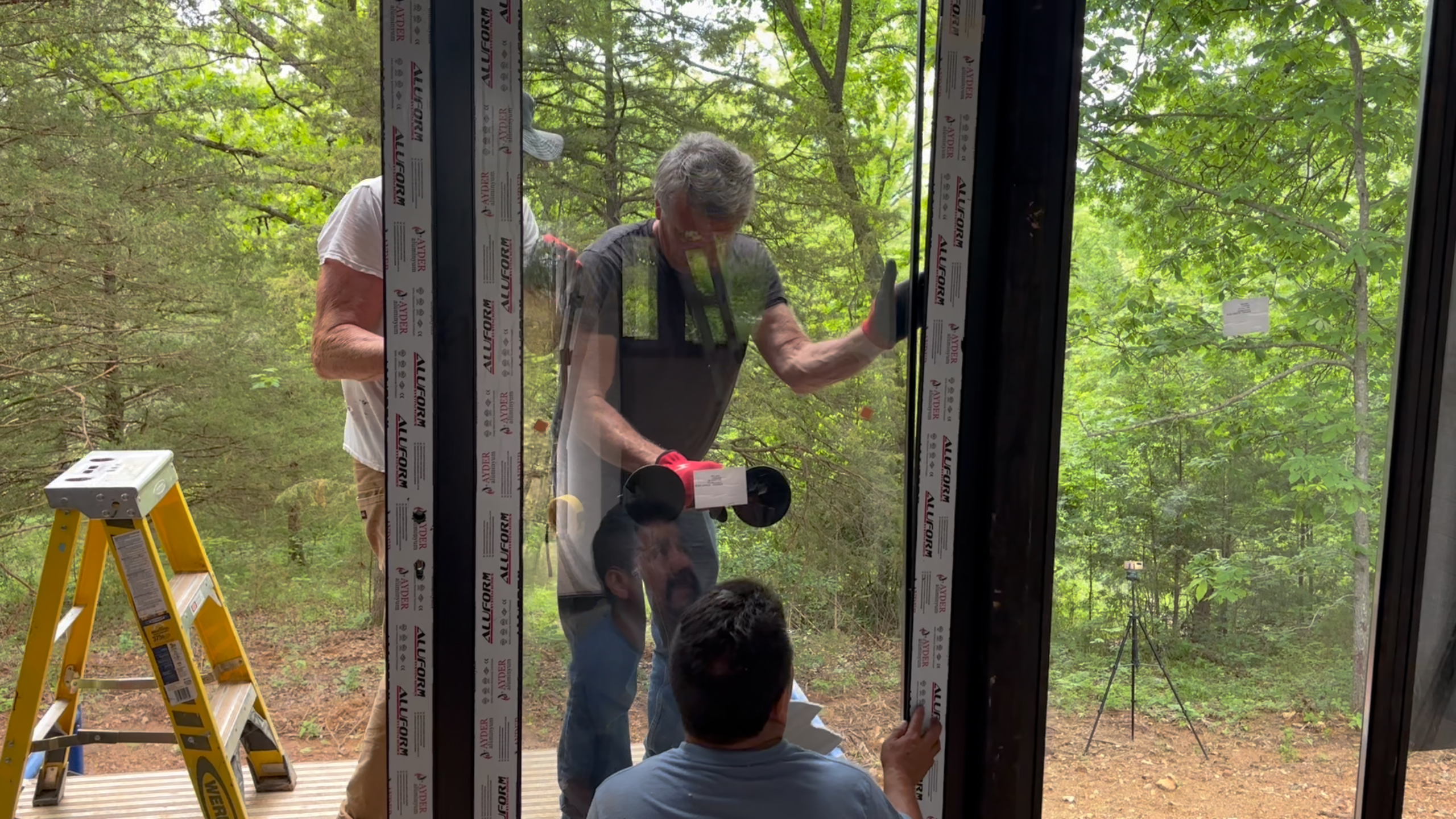 Panoramic front glazing assembly during construction of the Arkansas Aries 96 cabin.