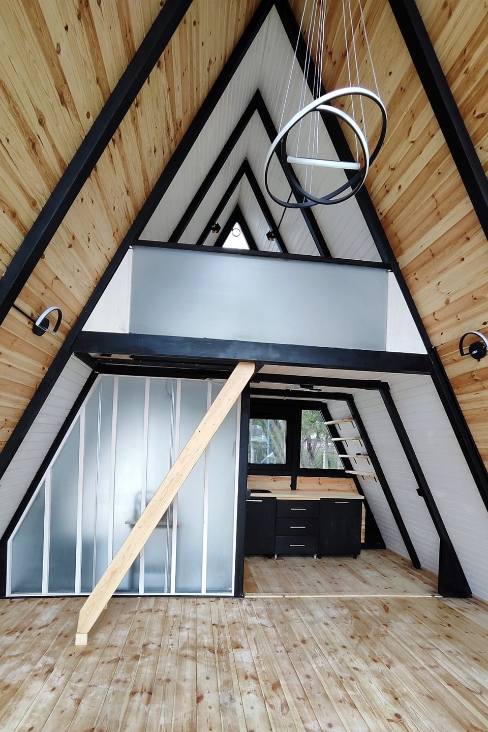 Assembled Stella 53 prototype interior before furnishing, with loft and kitchen