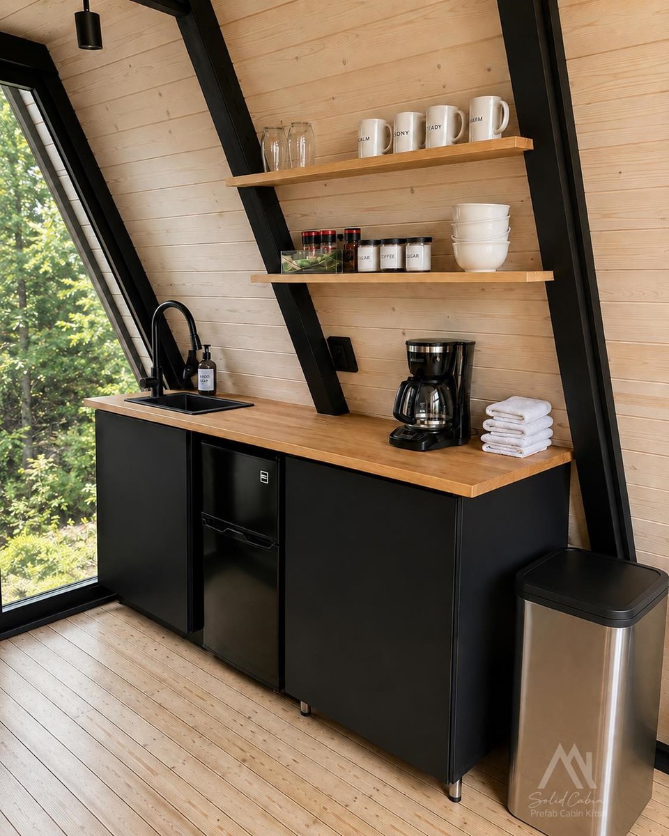 Project-specific kitchenette with dark cabinets, open shelves and timber finishes.