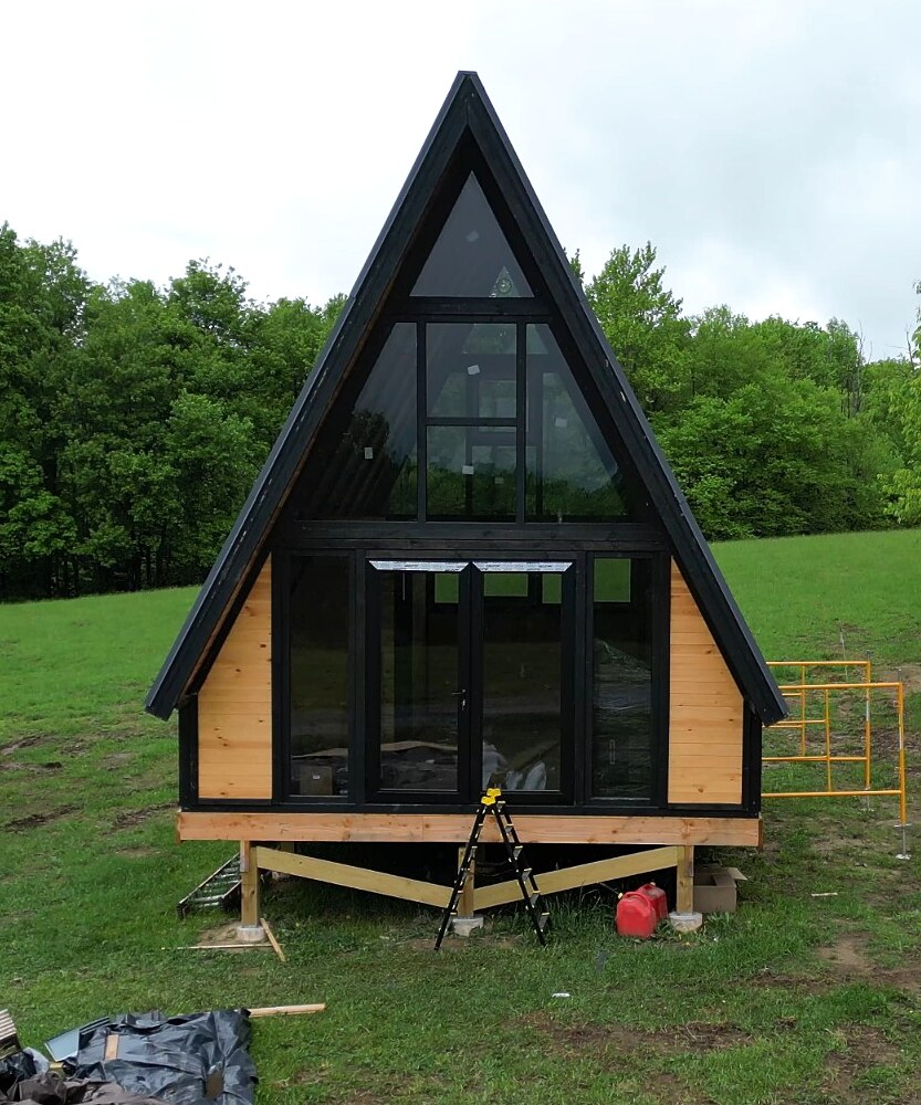 Stella 70 A-frame cabin front during assembly at WV ATV Resort