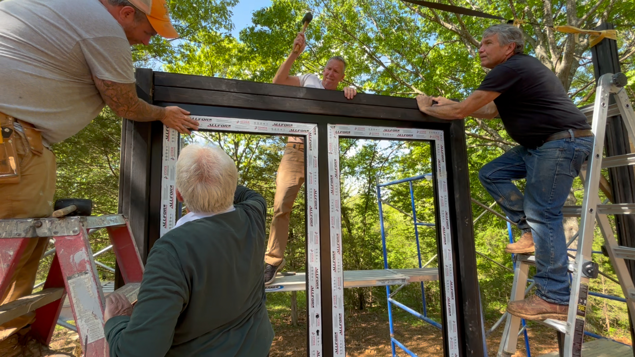 Window frame being installed in the timber structure of the Arkansas Aries 96 cabin.