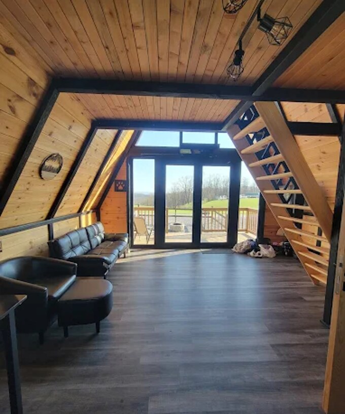 Completed living area beneath the loft inside a Stella 70 cabin at WV ATV Resort