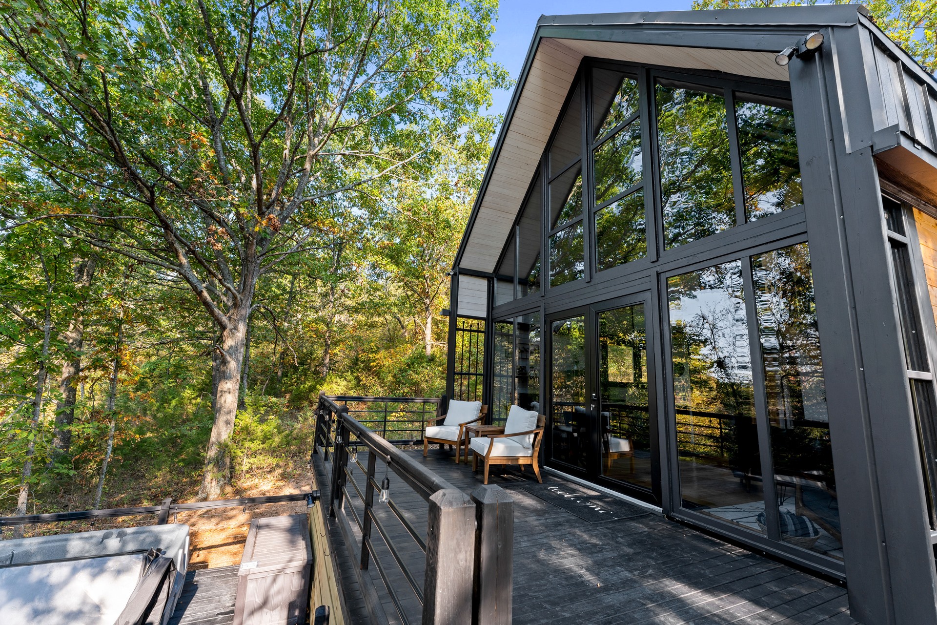Completed side and front exterior with deck at the Arkansas Aries 96 project.