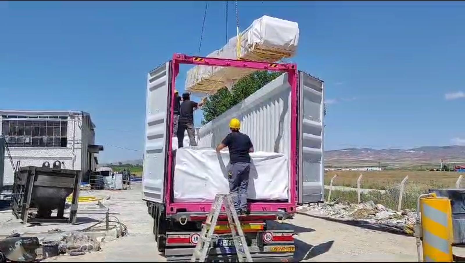 Open-top container loading for an A-frame cabin kit shipment to the United States