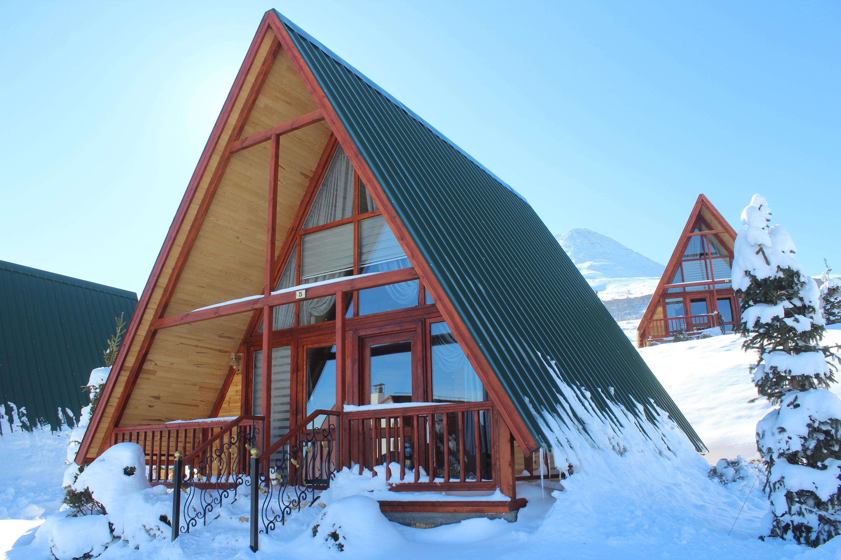 SolidCabin Stella 82 timber cabin kit adapted for a cold and snowy climate