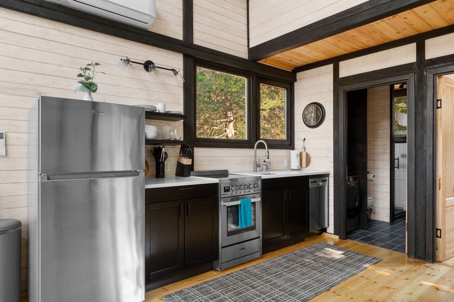 Kitchen cabinets, countertop and appliances in the completed Aries 96 cabin in Omaha, Arkansas.