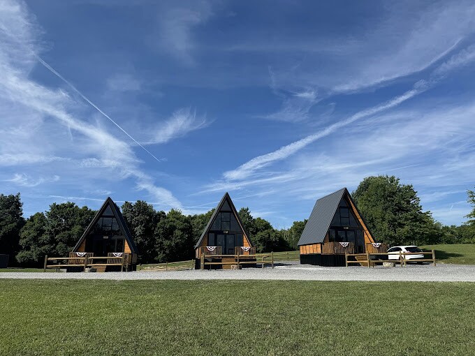 Three completed Stella 70 A-frame cabins at WV ATV Resort in West Virginia.