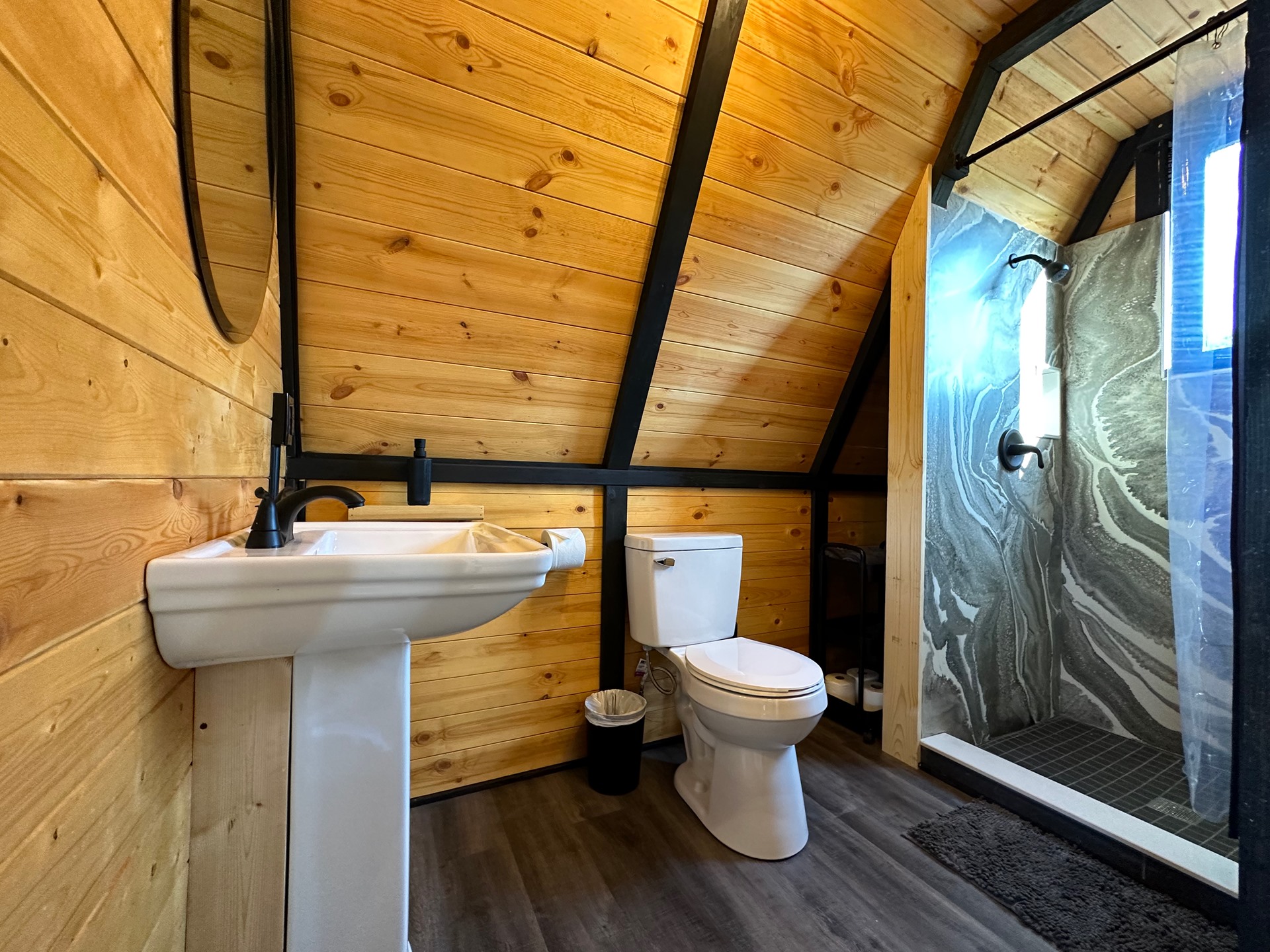 Finished bathroom and shower inside a Stella 70 cabin at WV ATV Resort.