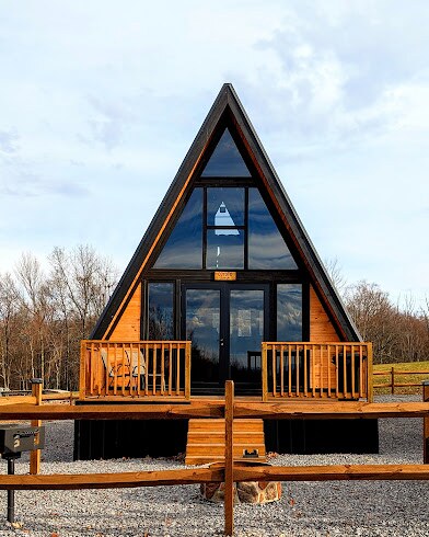 Stella 70 A-frame cabin with a wooden deck at West Virginia Rock ATV Resort