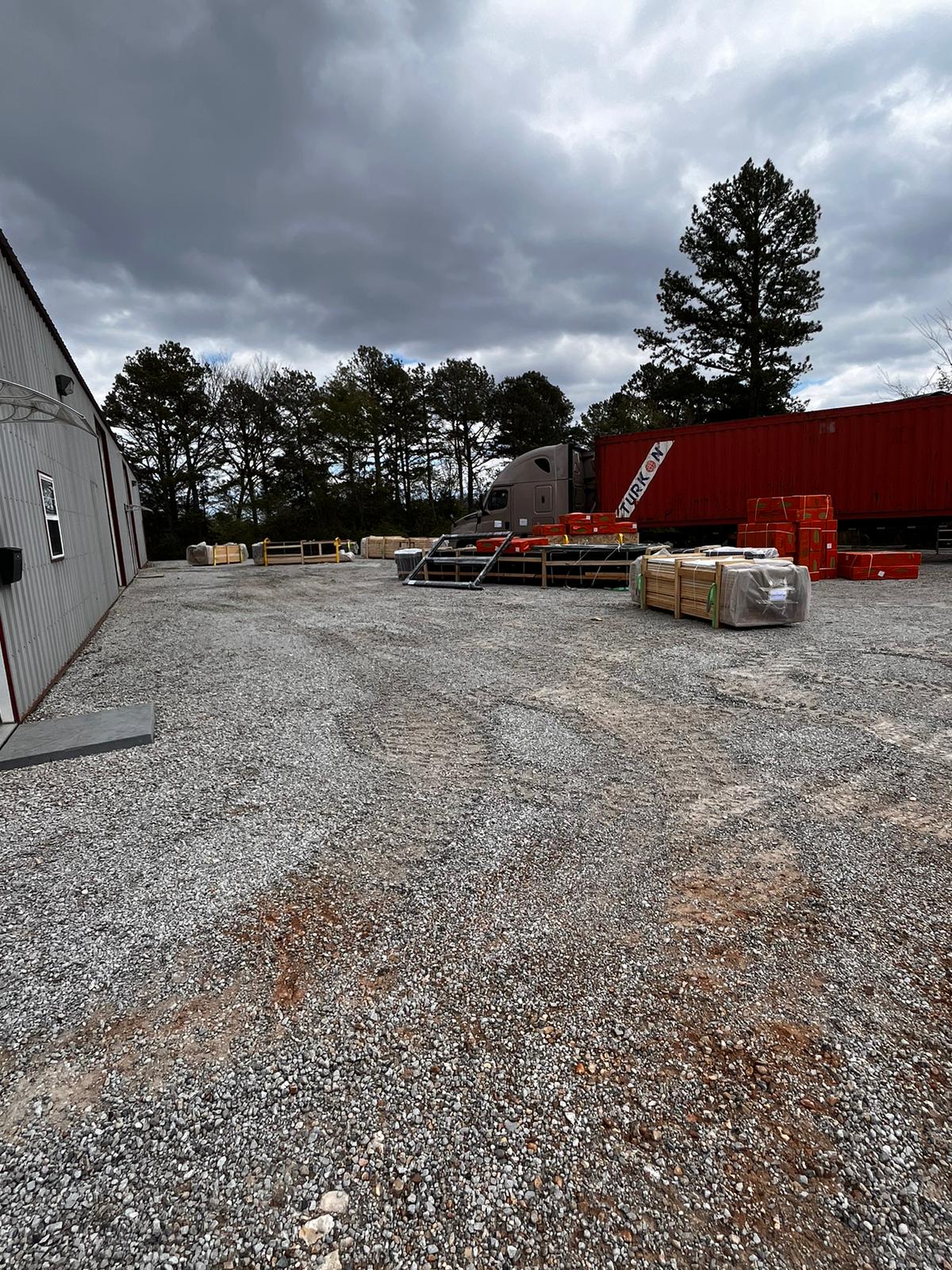 Aries 96 cabin-kit packages unloaded on ground after delivery