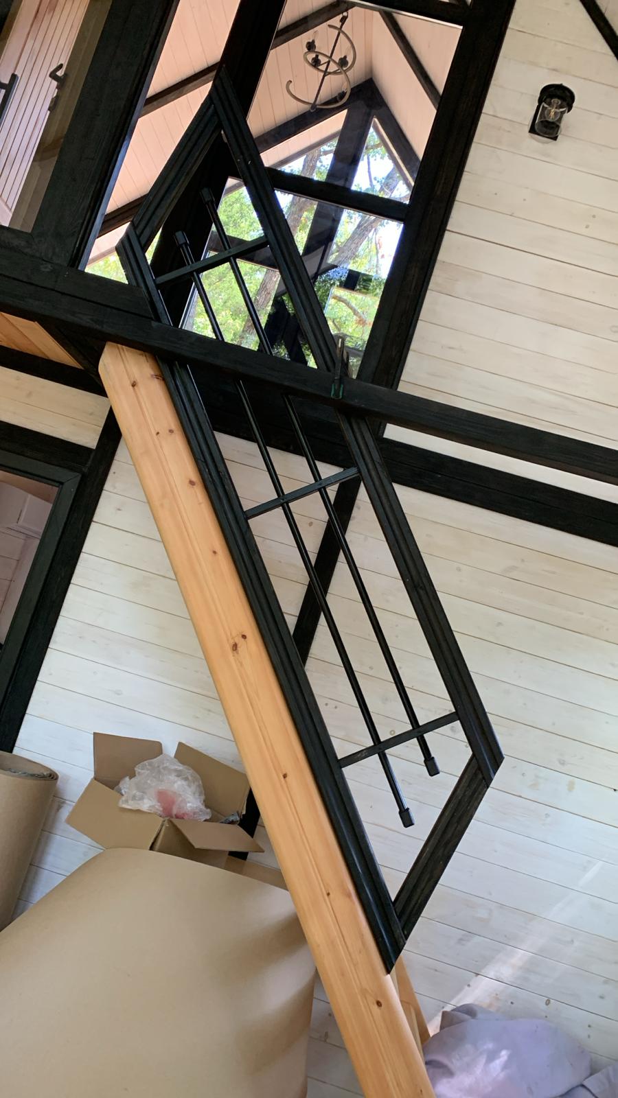 Black metal replacement component positioned inside the Arkansas Aries 96 cabin during interior completion.