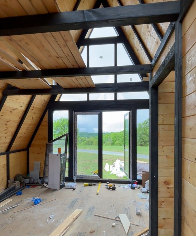 Living area beneath the loft during Stella 70 cabin assembly at WV ATV Resort