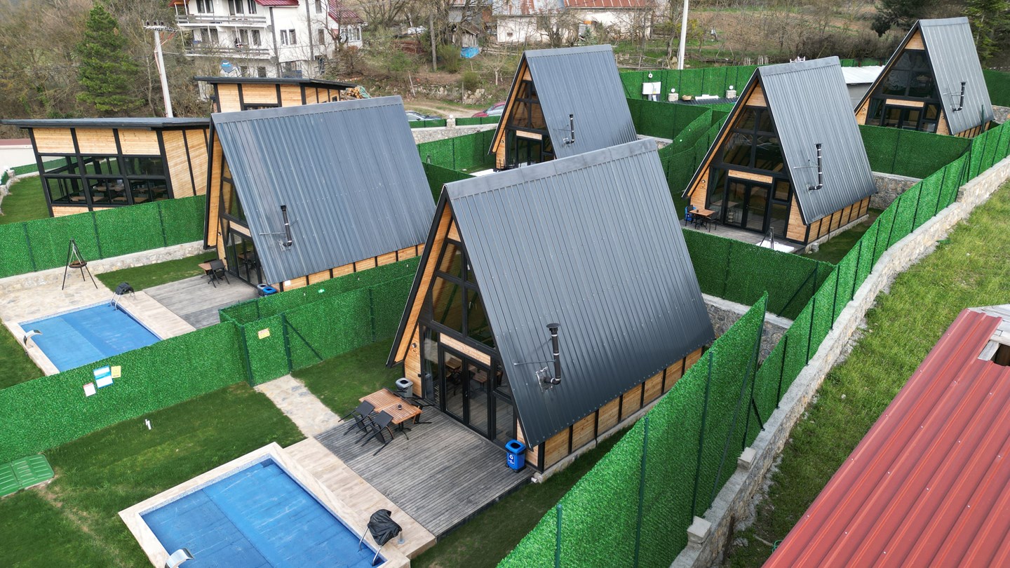 Completed A-frame cabins and private pools at a Turkey resort with Stella 70 and Stella 82 models