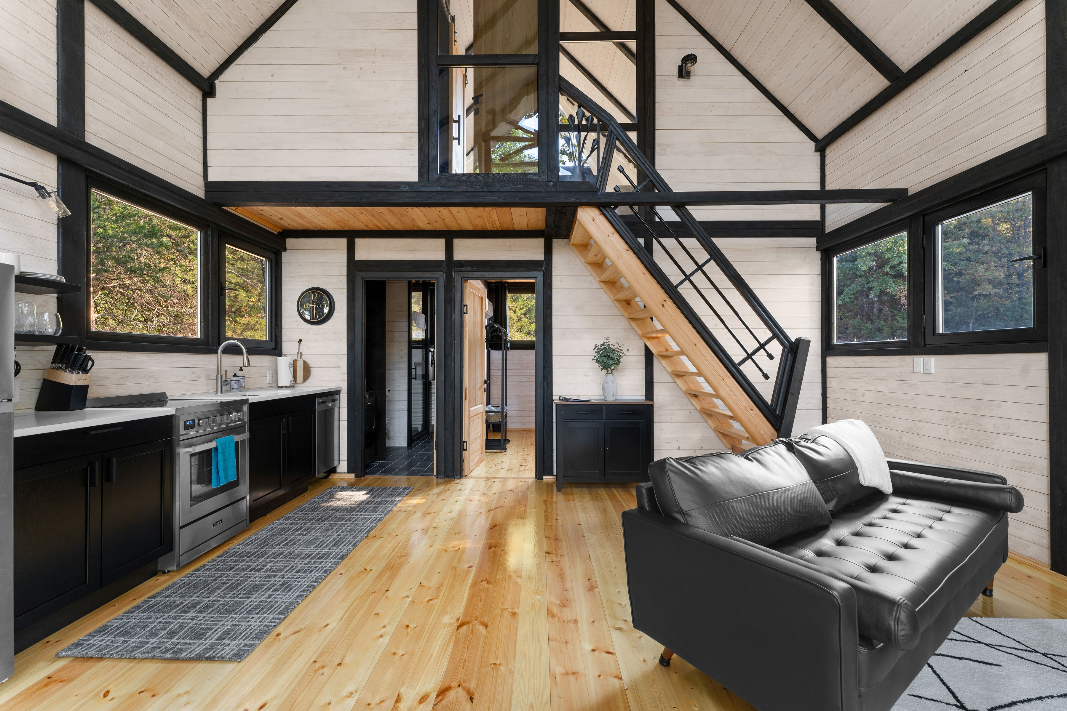 Finished Aries 96 interior showing the loft, staircase and open-plan living area.