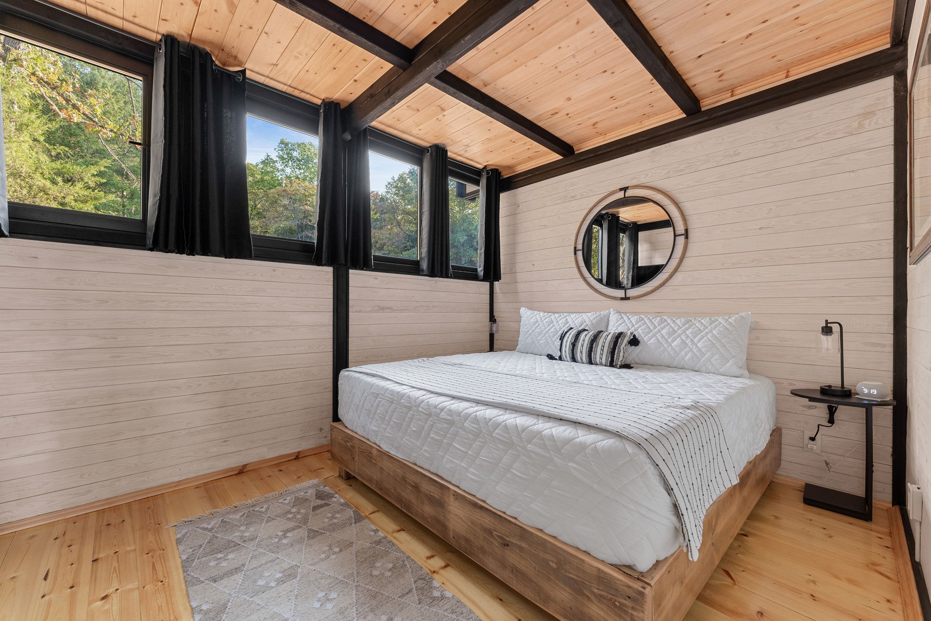 Ground-floor bedroom in the completed Aries 96 cabin in Omaha, Arkansas.