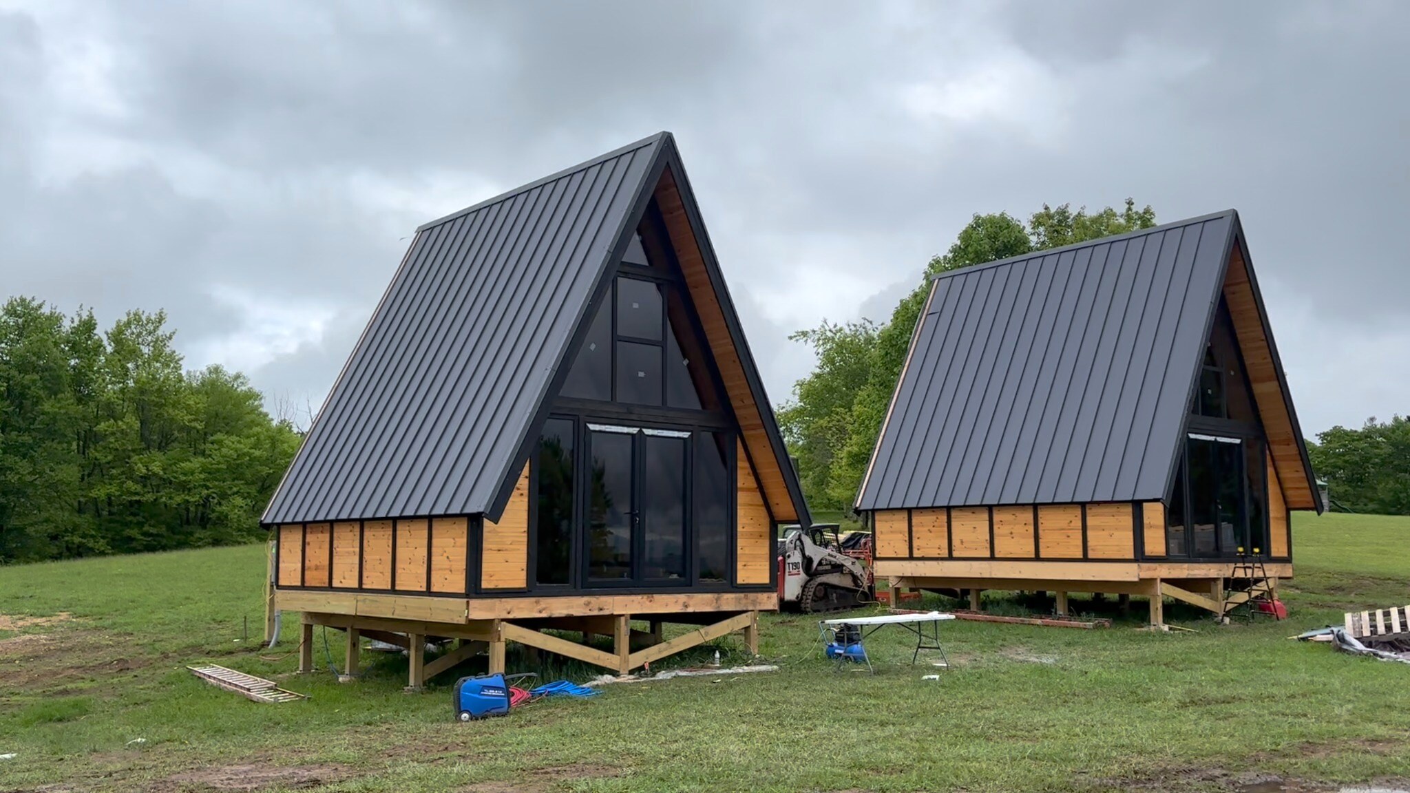 Front glazing installed on two Stella 70 A-frame cabins at WV ATV Resort