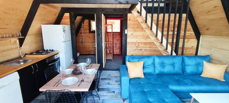 Living area, kitchen and staircase in an earlier Stella 70 resort application.