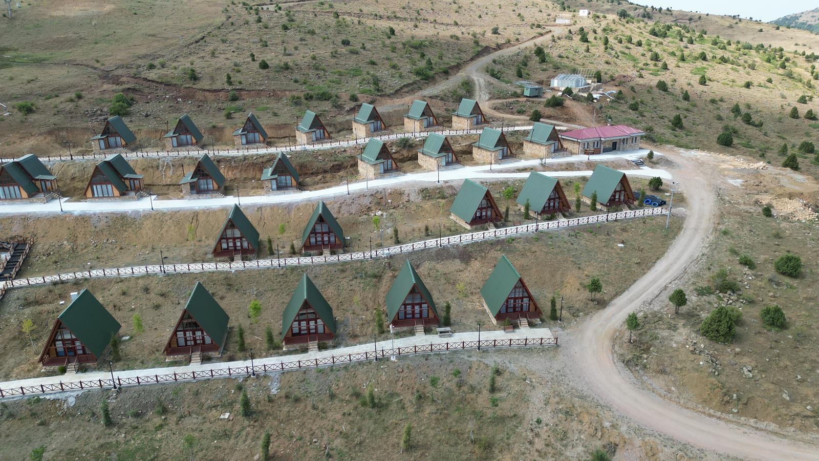Multi-unit A-frame cabin project in Türkiye showing MasifEv’s earlier resort and rental cabin experience.