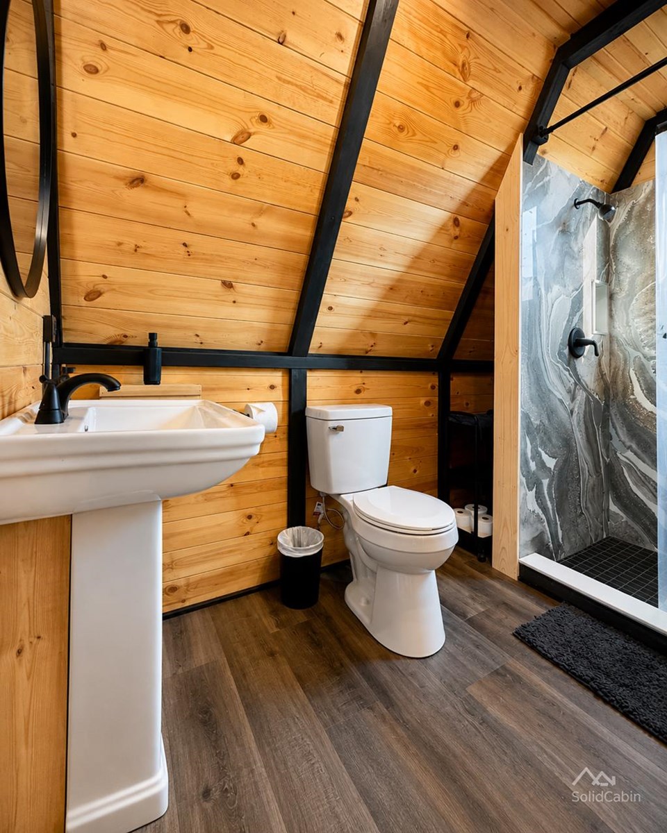 Bathroom in an earlier West Virginia cabin, showing locally completed fit-out.