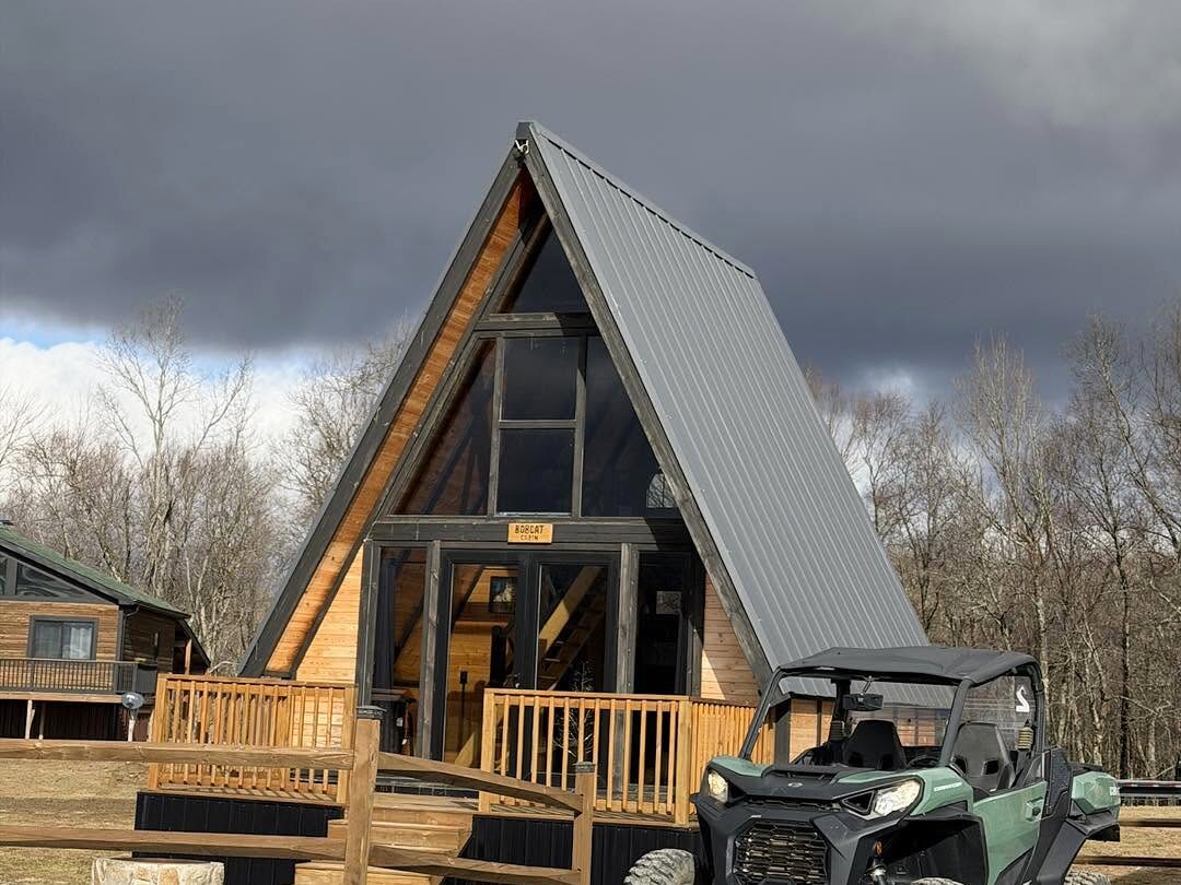 Stella 70 A-frame guest cabin with a UTV at WV ATV Resort.
