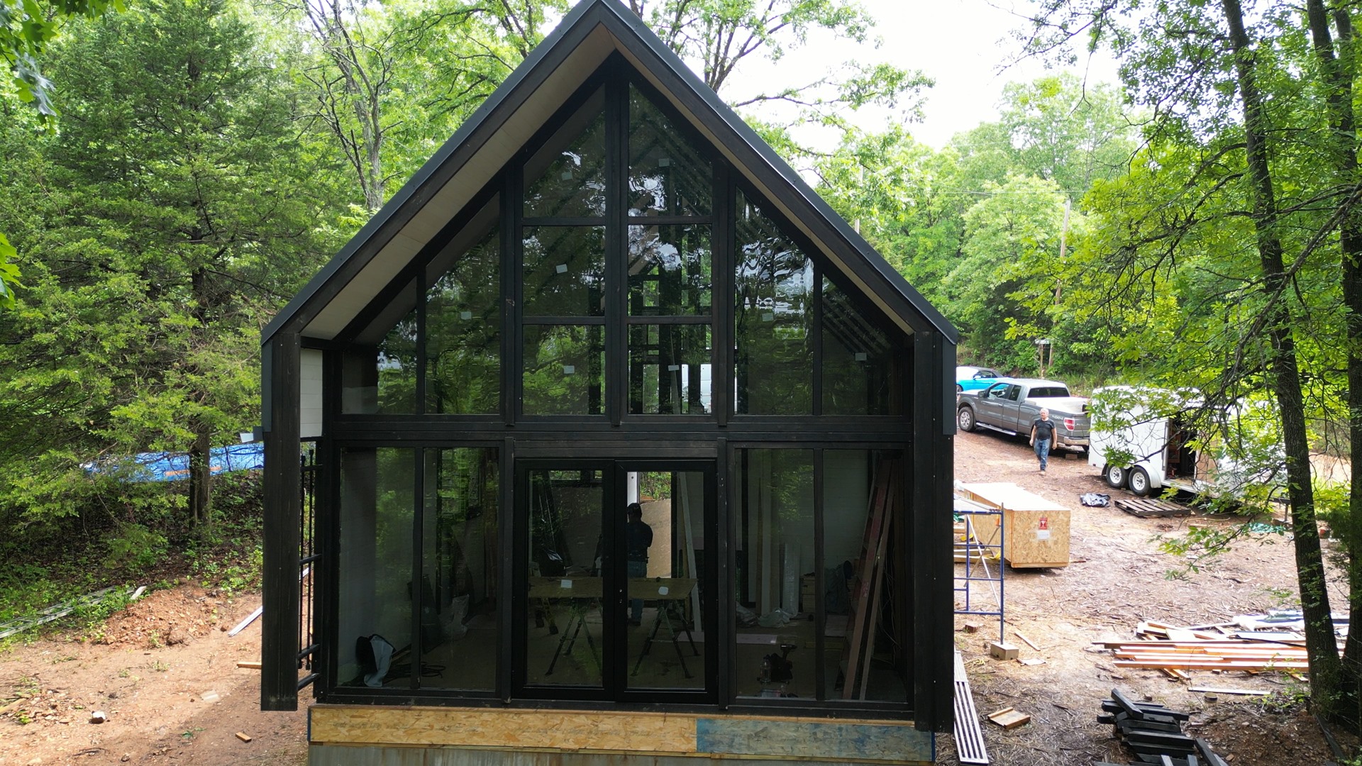 Front exterior shell with glazing installed at the Aries 96 cabin project in Omaha, Arkansas.