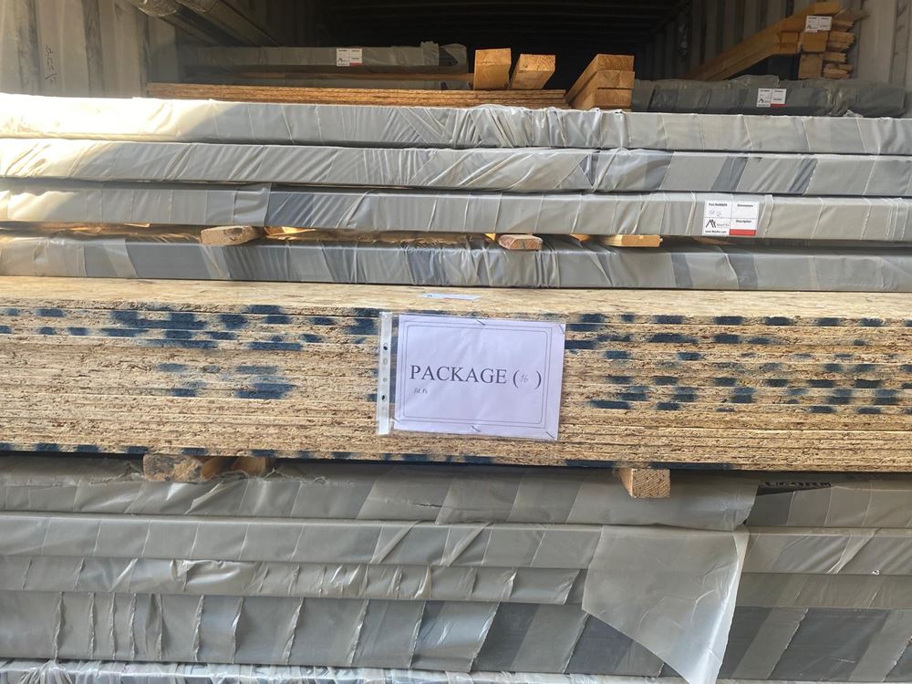 Coded and labeled Aries 116 component package prepared for container loading.