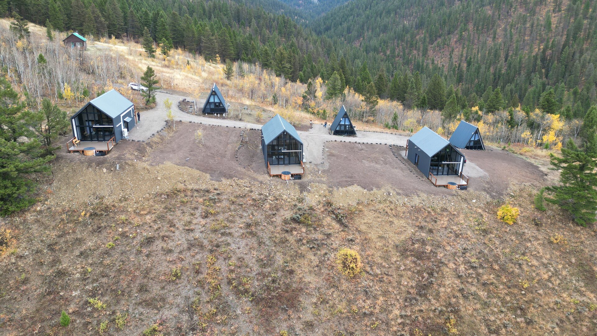 Aerial view of the completed cabin site and access area in Island Park, Idaho.