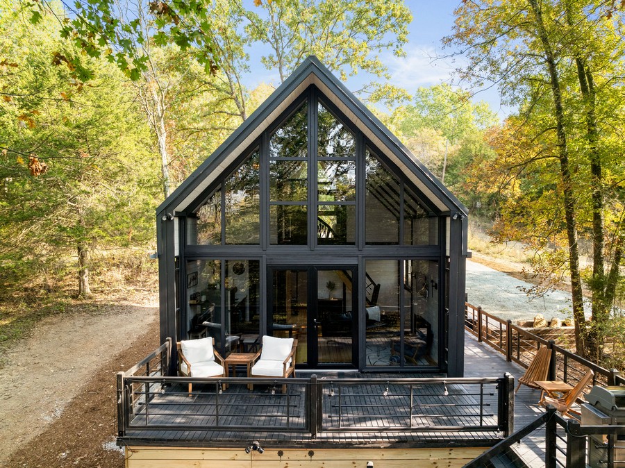 Aries 96 cabin exterior in the Arkansas concept, surrounded by woodland in Omaha