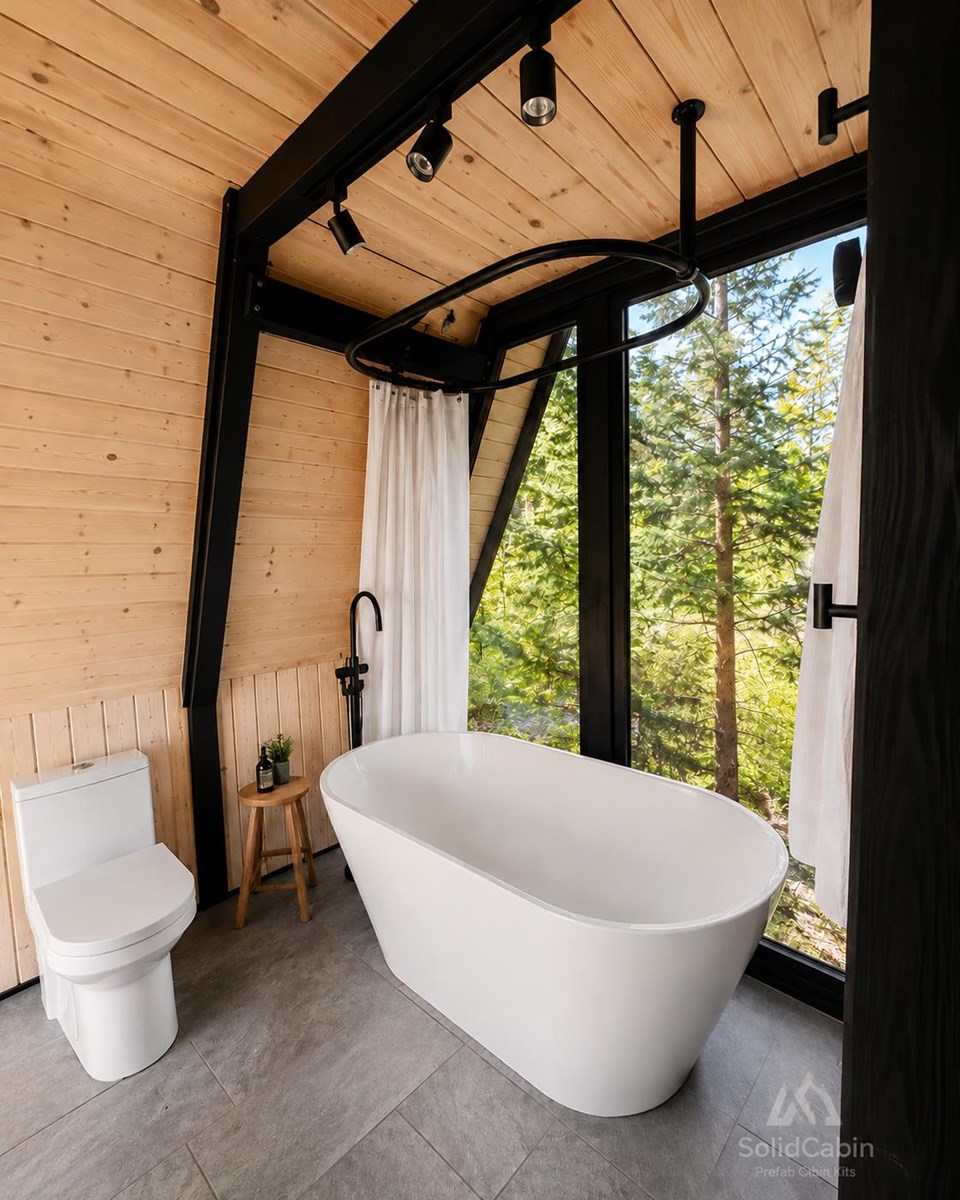Completed bathroom with a freestanding tub. Fixtures and fit-out are locally supplied.